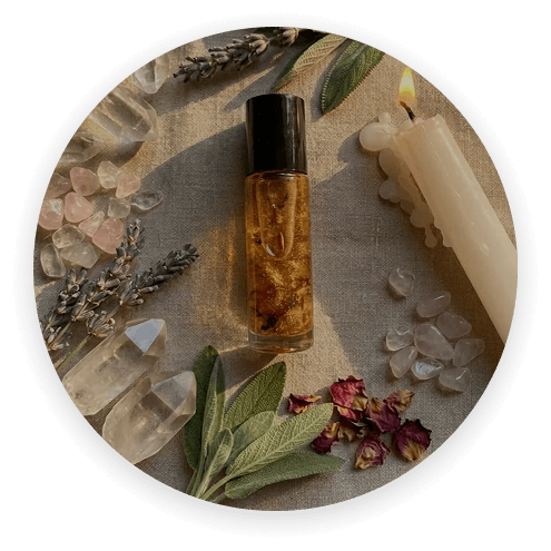 A handmade aromatherapy roller with herbs and crystals
