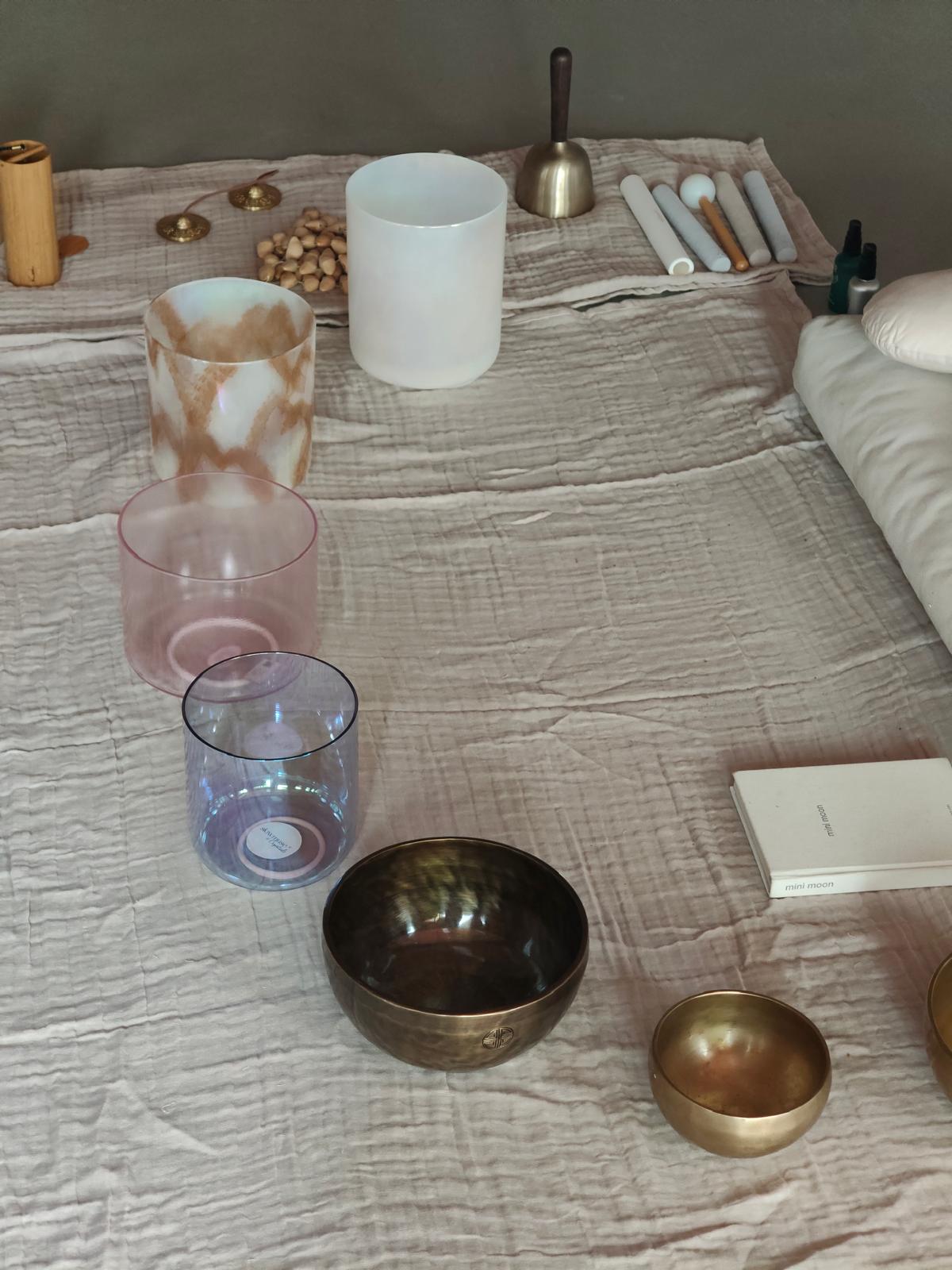 Crystal singing bowls and ceremony instruments prepared for a Slowmuse circle