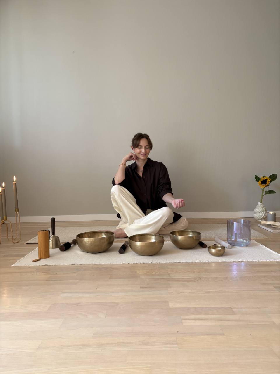 Michèle Gabrielle seated with singing bowls